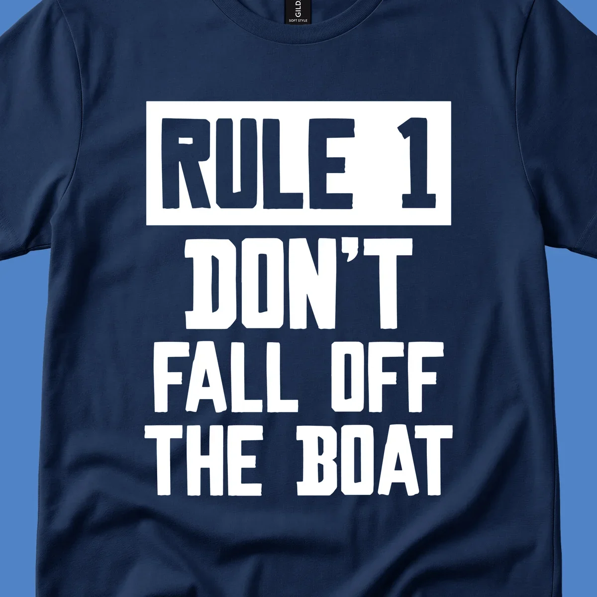 Bold gray and white typography reading 'Rule 1 Don't Fall Off The Boat' - a humorous nautical design