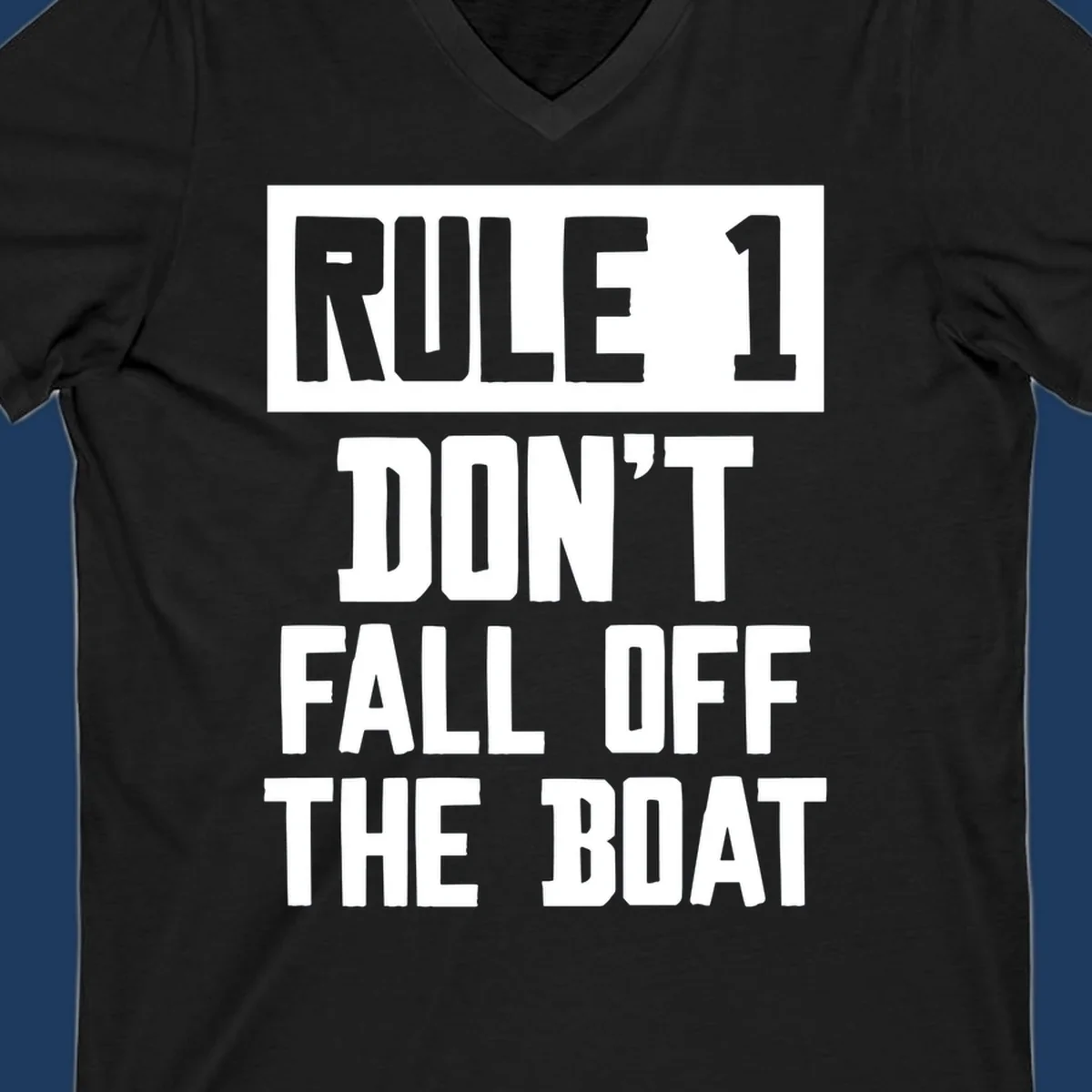 Bold gray and white typography reading 'Rule 1 Don't Fall Off The Boat' - a humorous nautical design