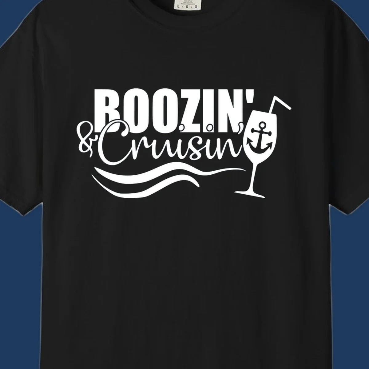 Boozin' and Cruising design with cocktail glass, anchor, and nautical waves in white on gray background