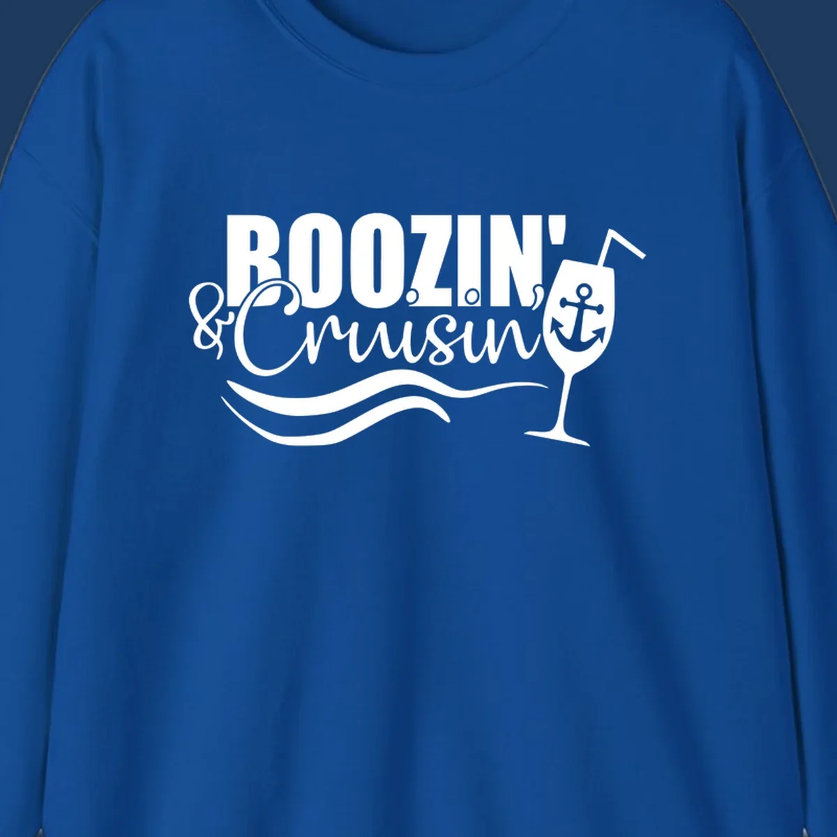 Boozin' and Cruising design with cocktail glass, anchor, and nautical waves in white on gray background