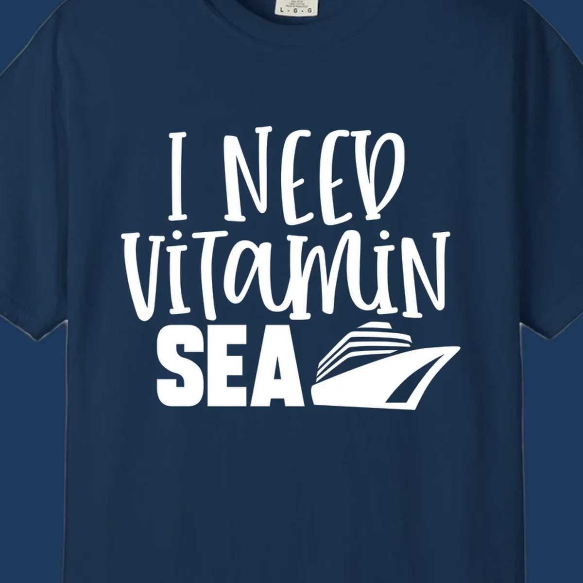 White text reading 'I NEED VITAMIN SEA' with a cruise ship illustration on gray background