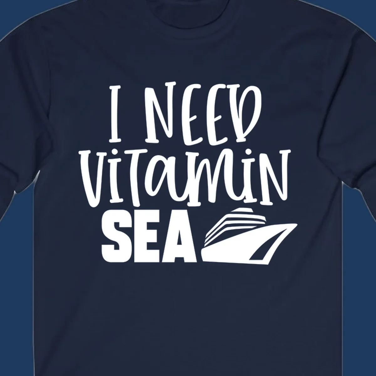 White text reading 'I NEED VITAMIN SEA' with a cruise ship illustration on gray background