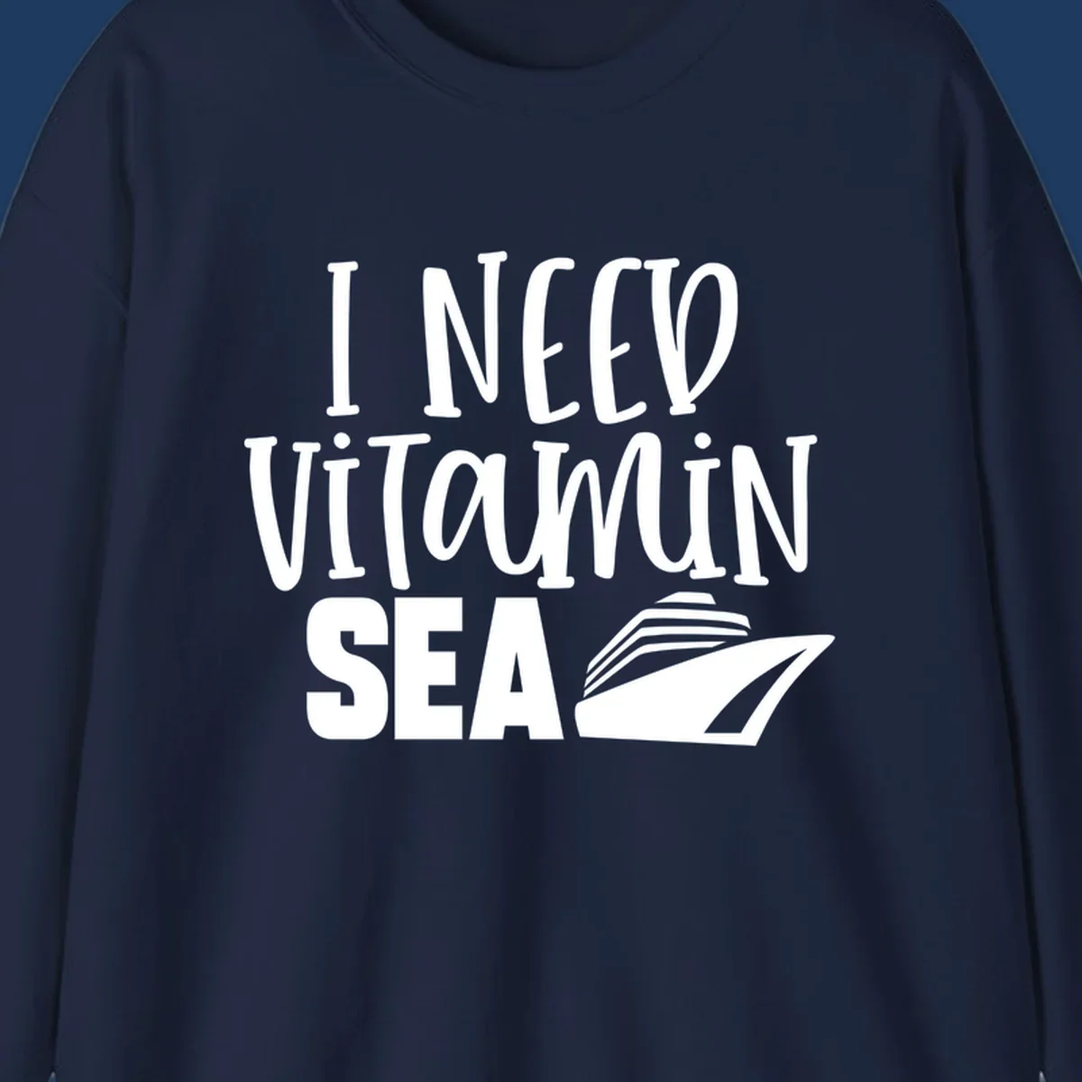 White text reading 'I NEED VITAMIN SEA' with a cruise ship illustration on gray background