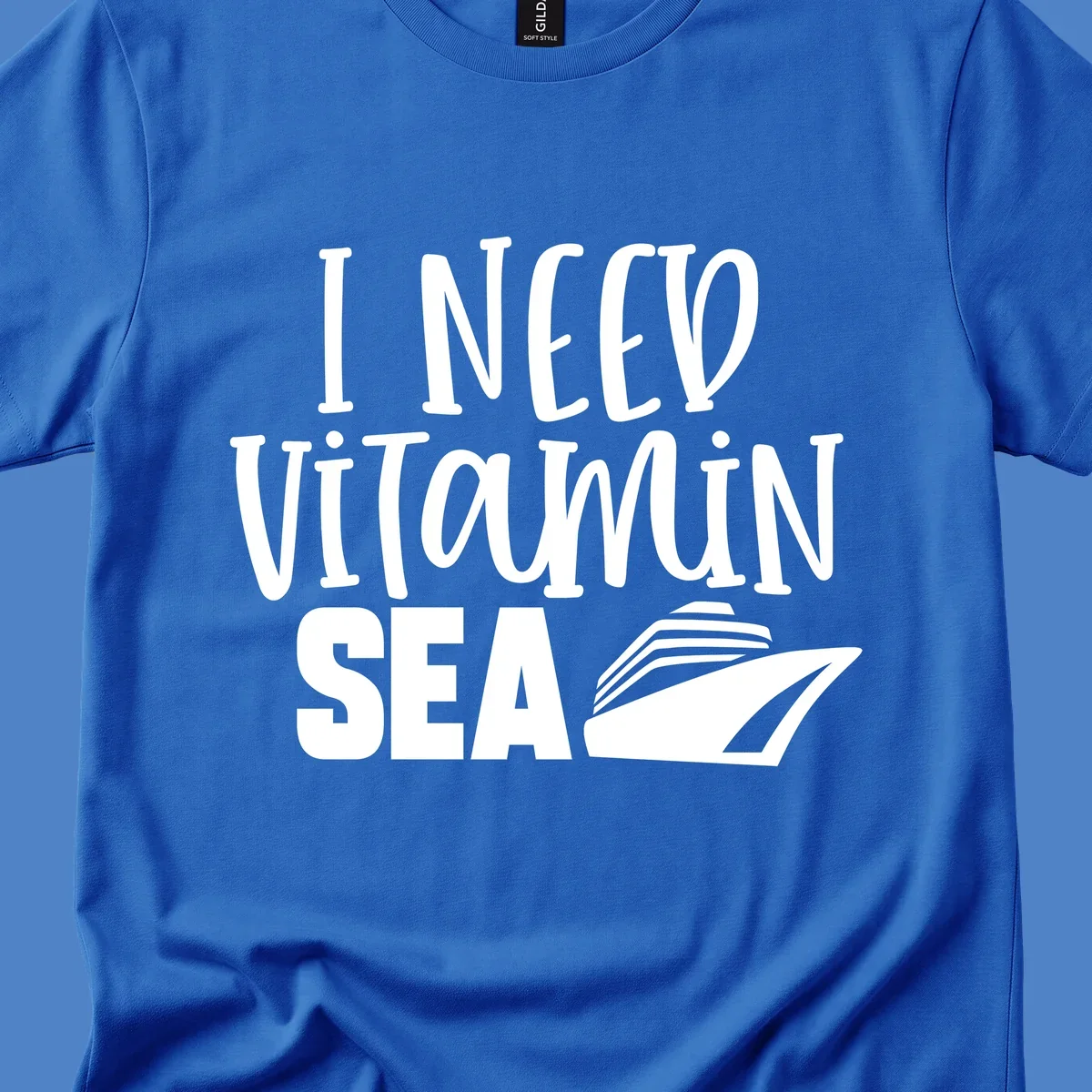 White text reading 'I NEED VITAMIN SEA' with a cruise ship illustration on gray background