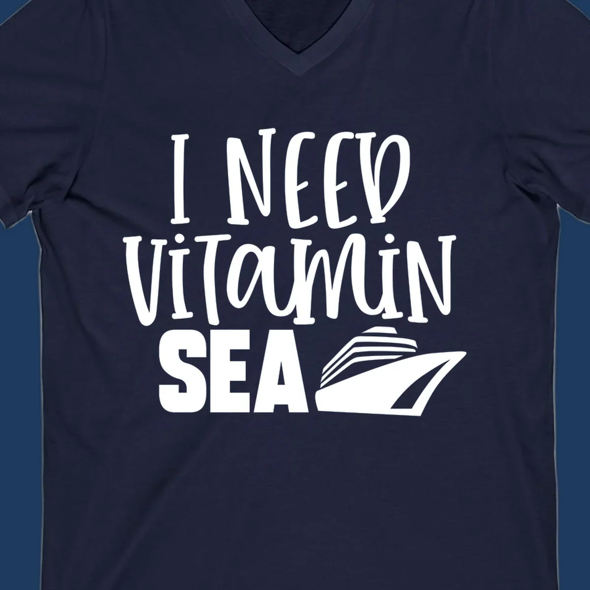 White text reading 'I NEED VITAMIN SEA' with a cruise ship illustration on gray background