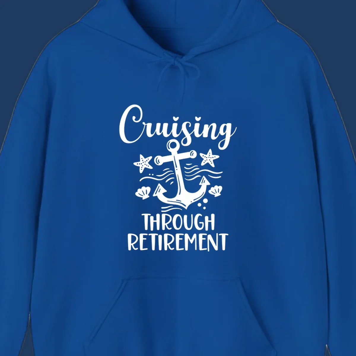 Cruising through retirement nautical design with white anchor, starfish, seashells, and ocean waves on gray background