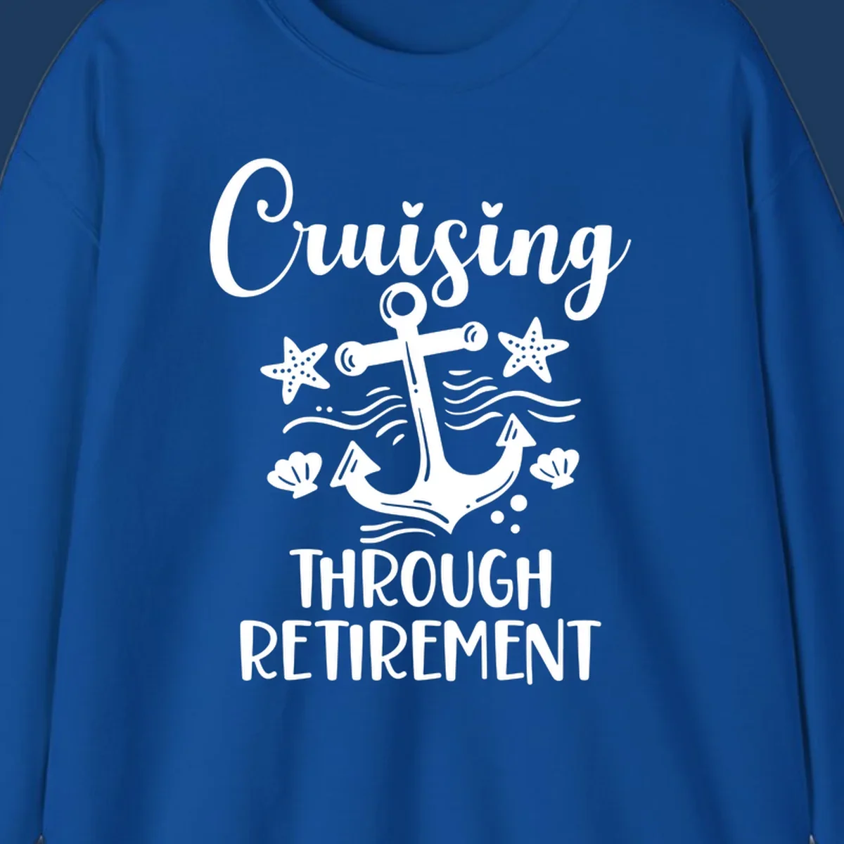 Cruising through retirement nautical design with white anchor, starfish, seashells, and ocean waves on gray background