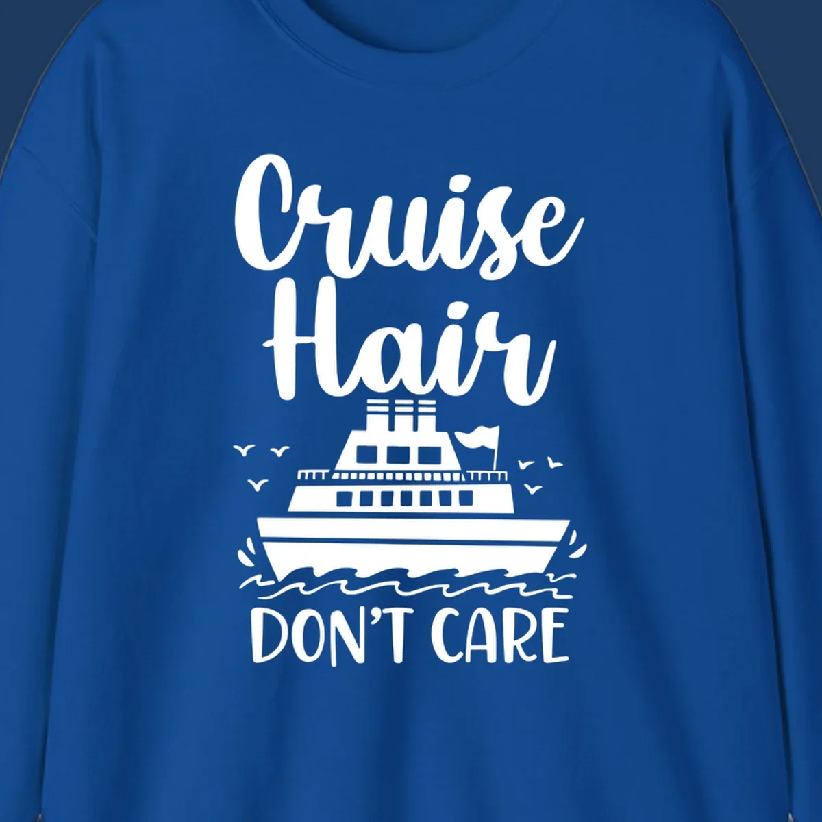 Cruise hair don't care design featuring a white cruise ship on ocean waves with seagulls, playful vacation lettering on gray background