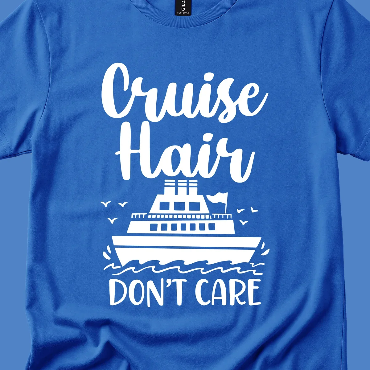 Cruise hair don't care design featuring a white cruise ship on ocean waves with seagulls, playful vacation lettering on gray background