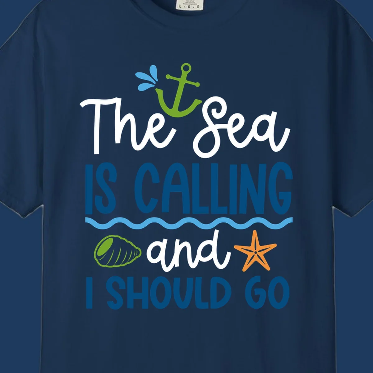 Gray tee design with 'The Sea Is Calling and I Should Go' text in white and blue, decorated with nautical icons including anchor, starfish, seashell, and ocean waves.