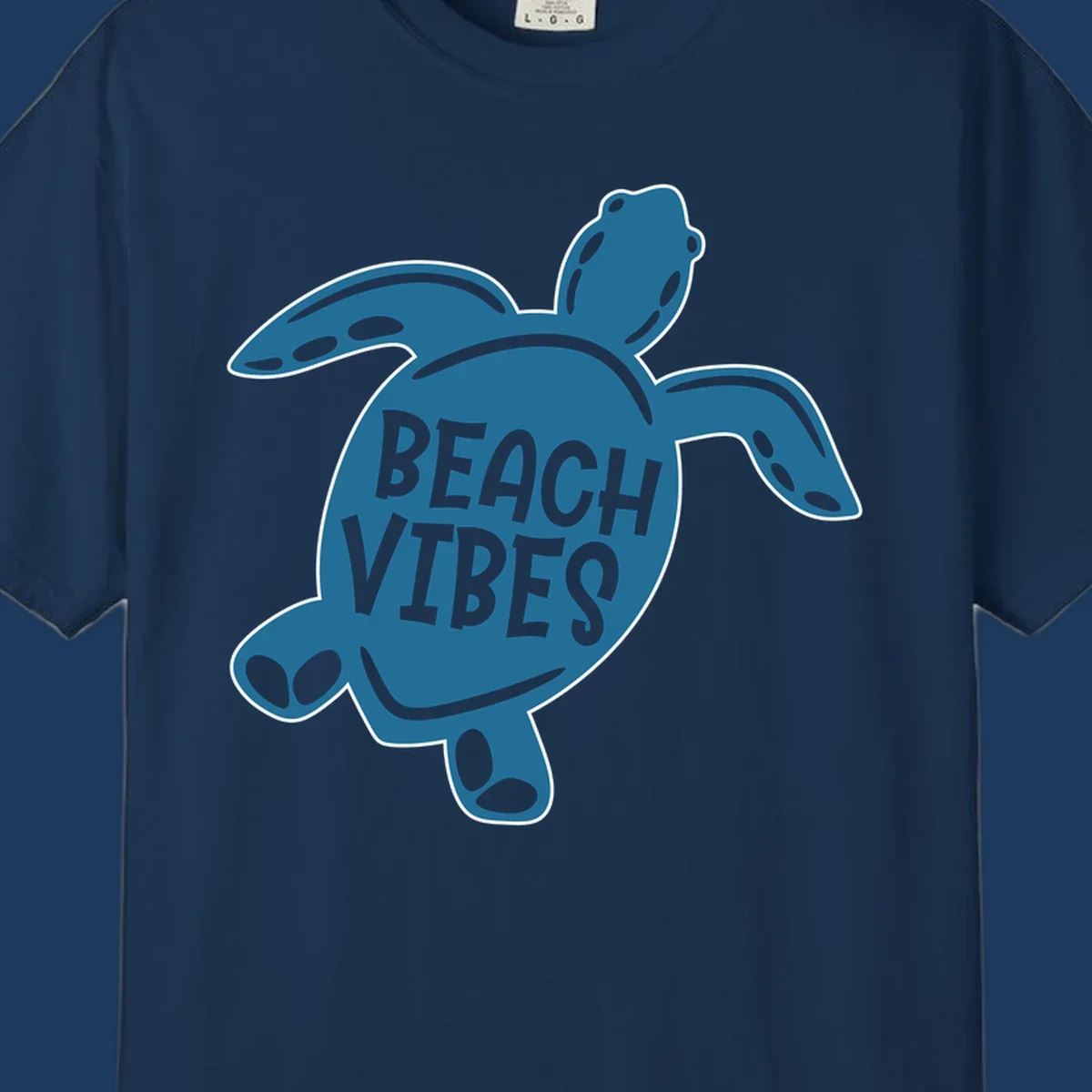 Teal sea turtle illustration with spotted shell pattern and 'Beach Vibes' text centered on the shell