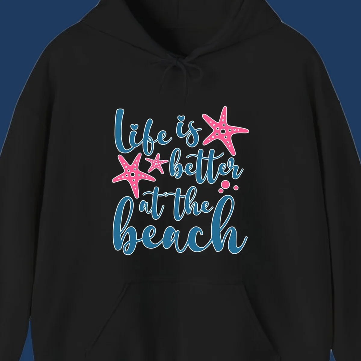 Life is better at the beach design with teal cursive text, pink starfish with white dots, and bubbles on gray background