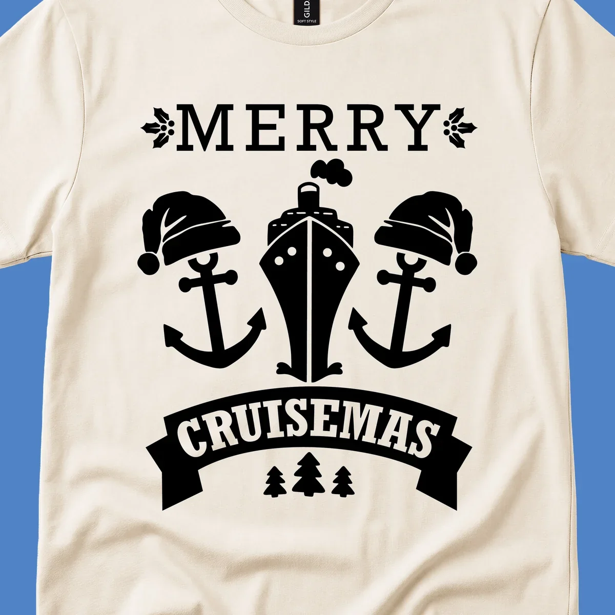 Merry Cruisemas nautical design featuring two Santa-hatted anchors and a ship with holly and evergreen trees on gray background.