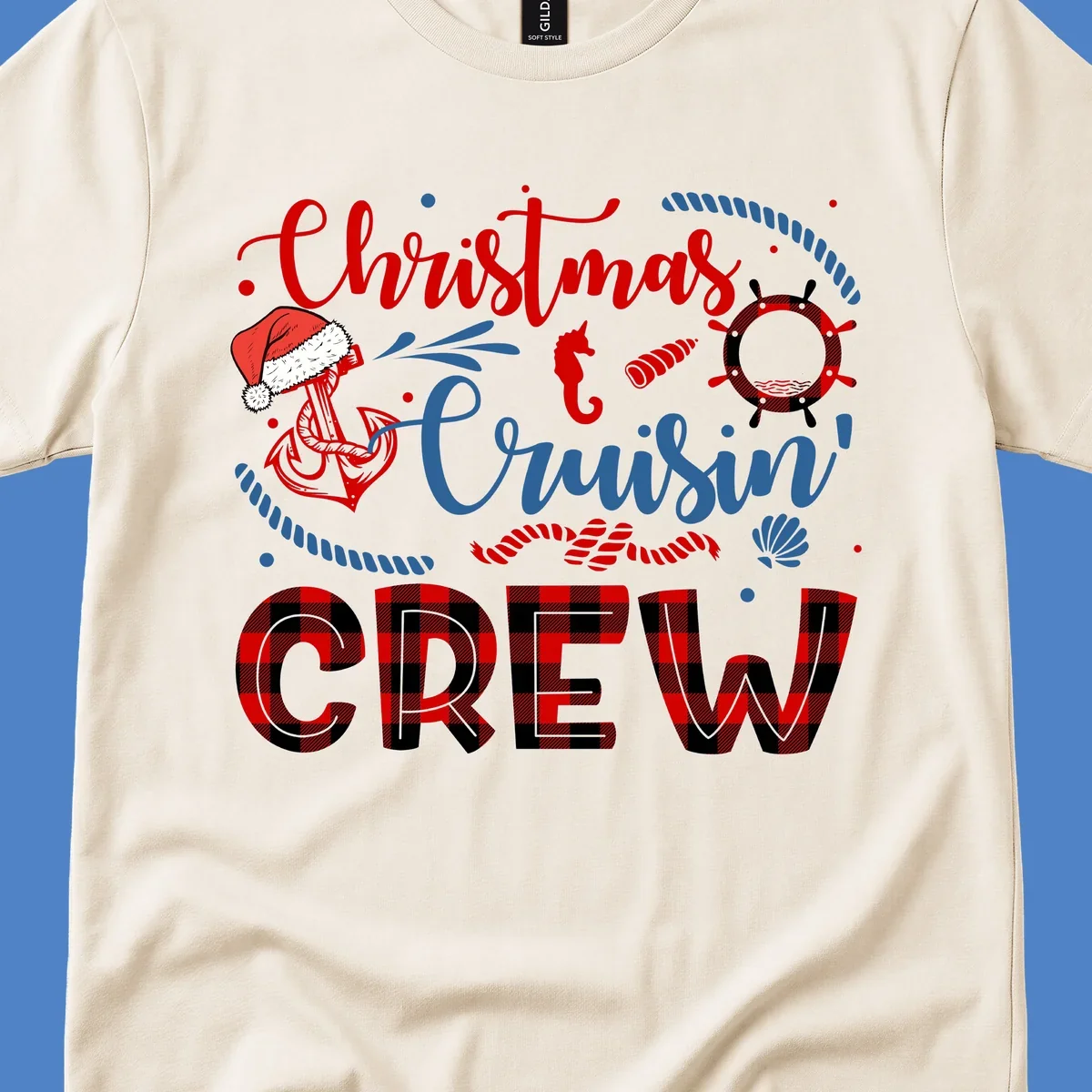 Christmas Cruisin' Cousin Crew design with Santa hat, ship wheel, anchor, and seahorse nautical elements in red, blue, and black on gray background