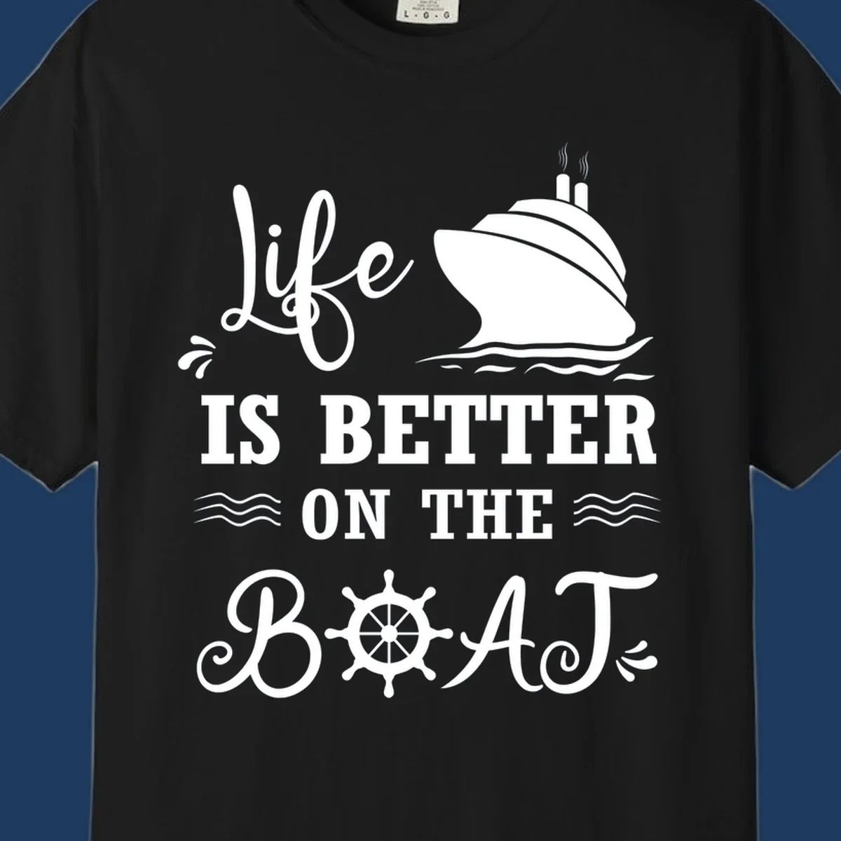 White nautical design on gray background with 'Life Is Better On The Boat' text, cruise ship, ship's wheel, and ocean waves