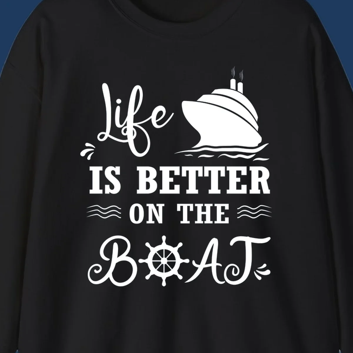 White nautical design on gray background with 'Life Is Better On The Boat' text, cruise ship, ship's wheel, and ocean waves