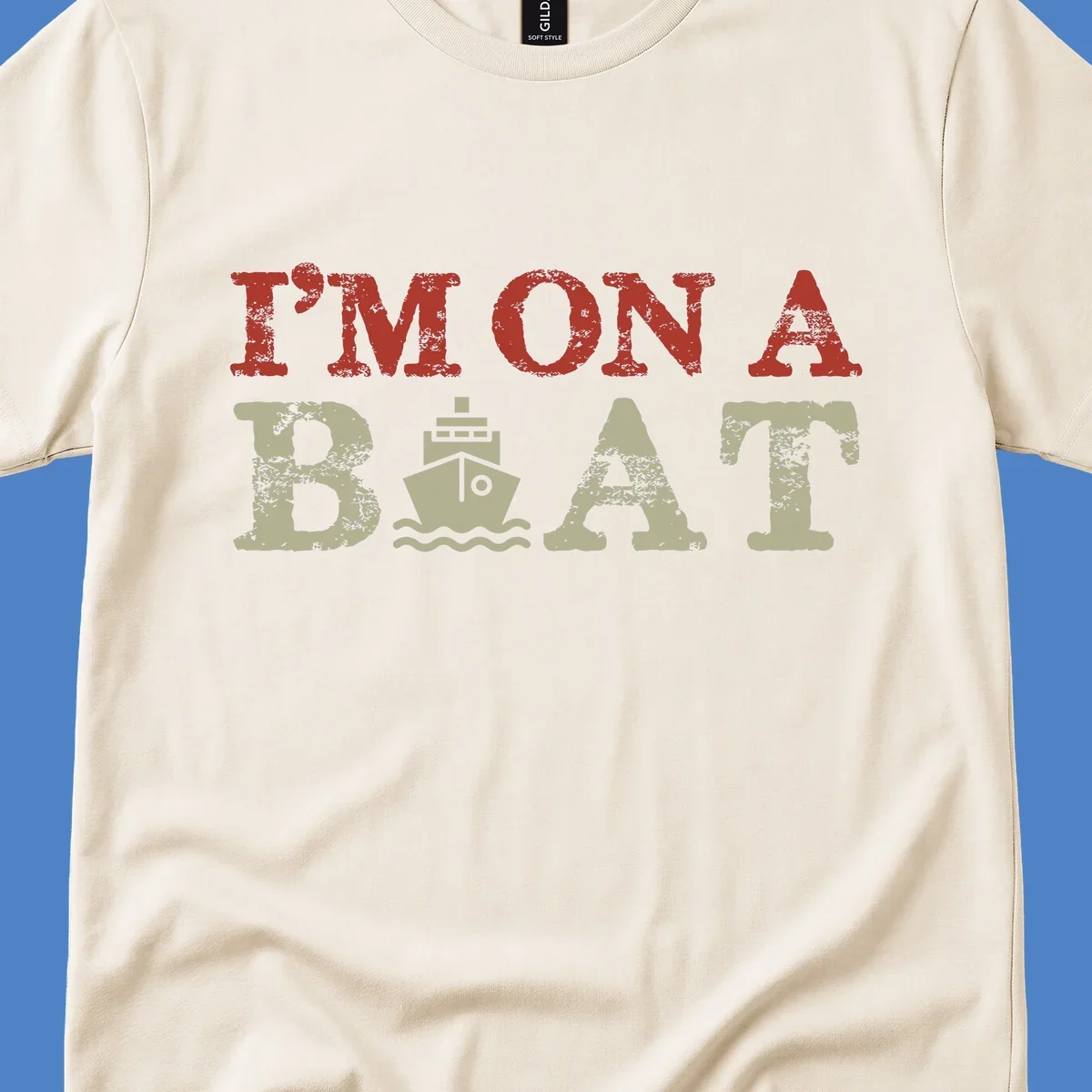 Red and cream distressed design featuring 'I'm On A Boat' text with ship and wave icons for cruise vacation apparel