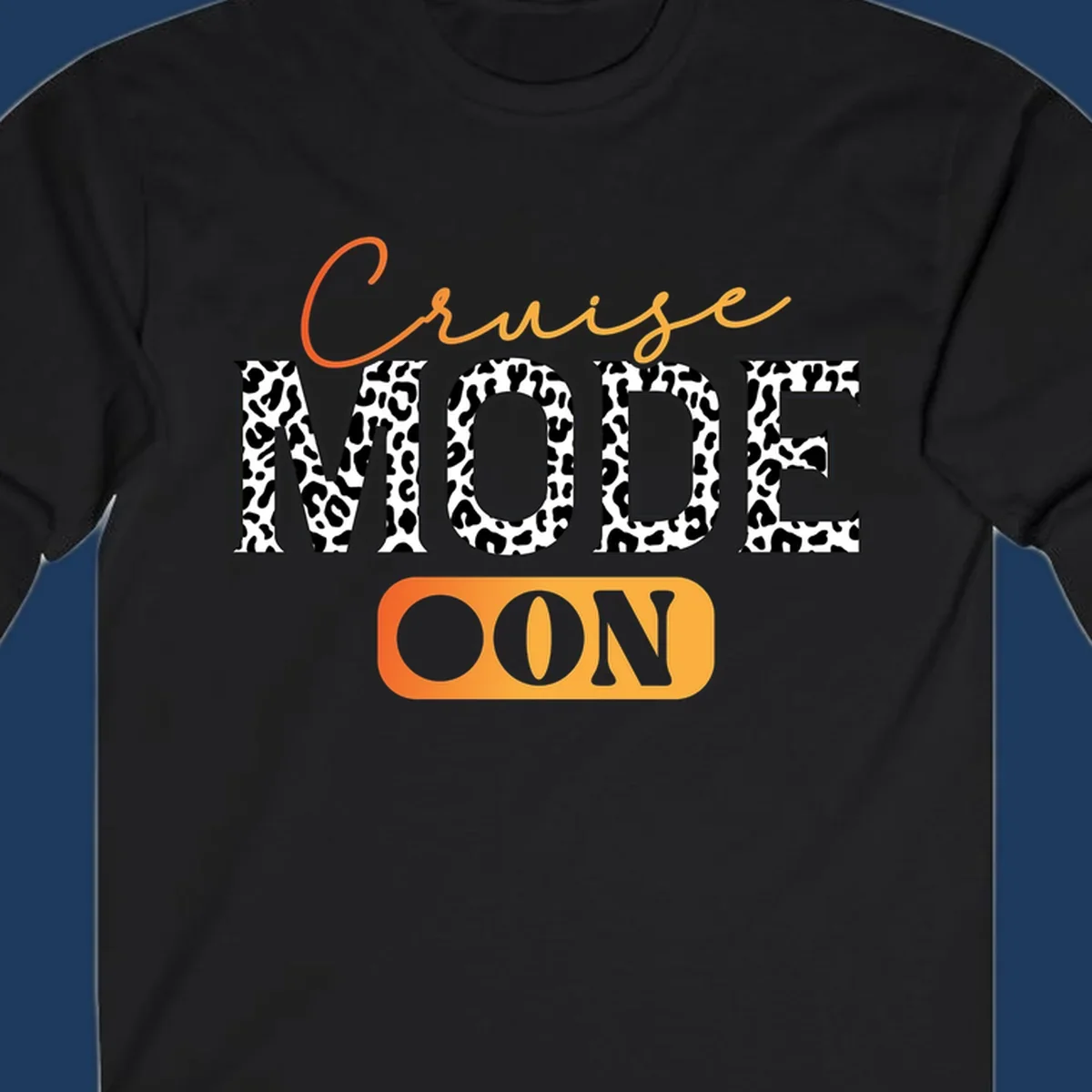 Cruise mode on design with orange cursive text and leopard print letters on gray background