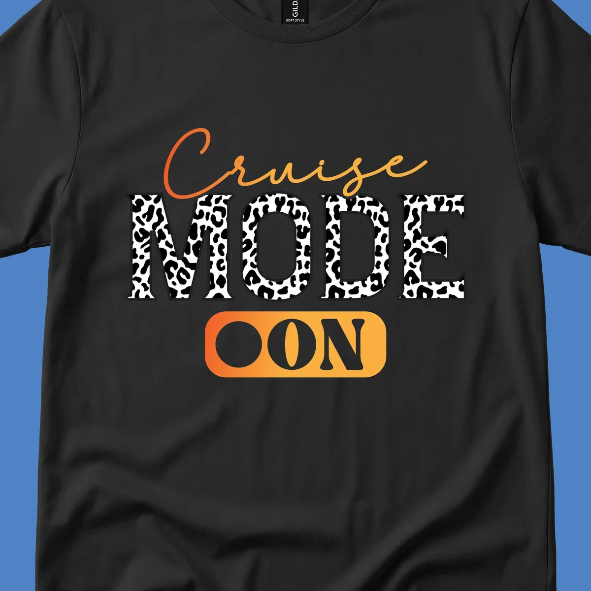Cruise mode on design with orange cursive text and leopard print letters on gray background