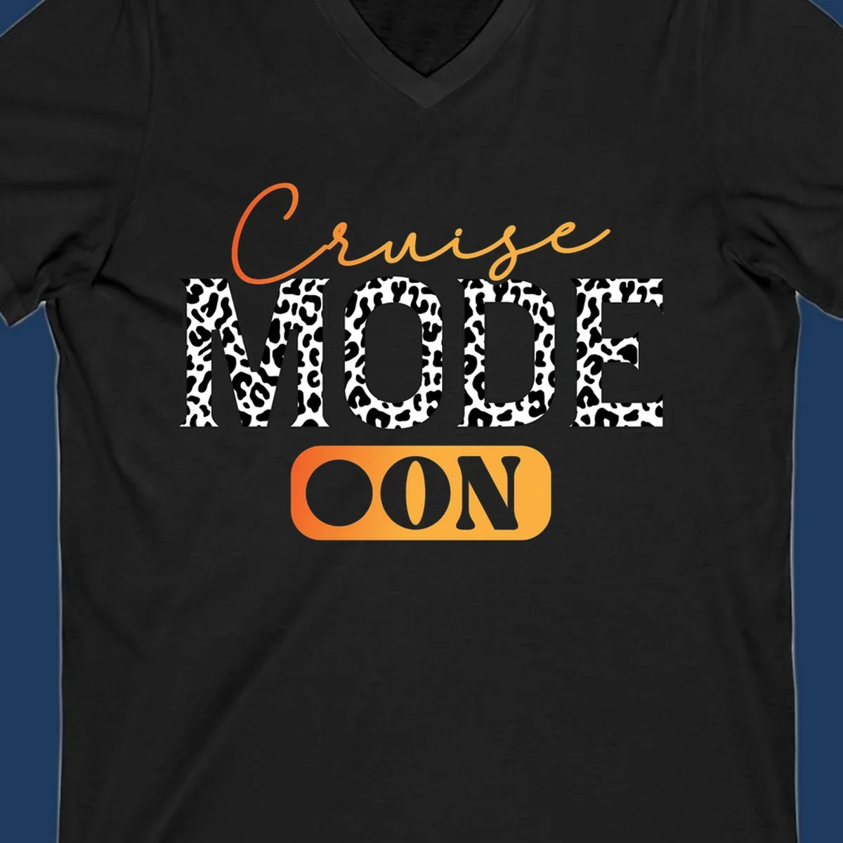 Cruise mode on design with orange cursive text and leopard print letters on gray background