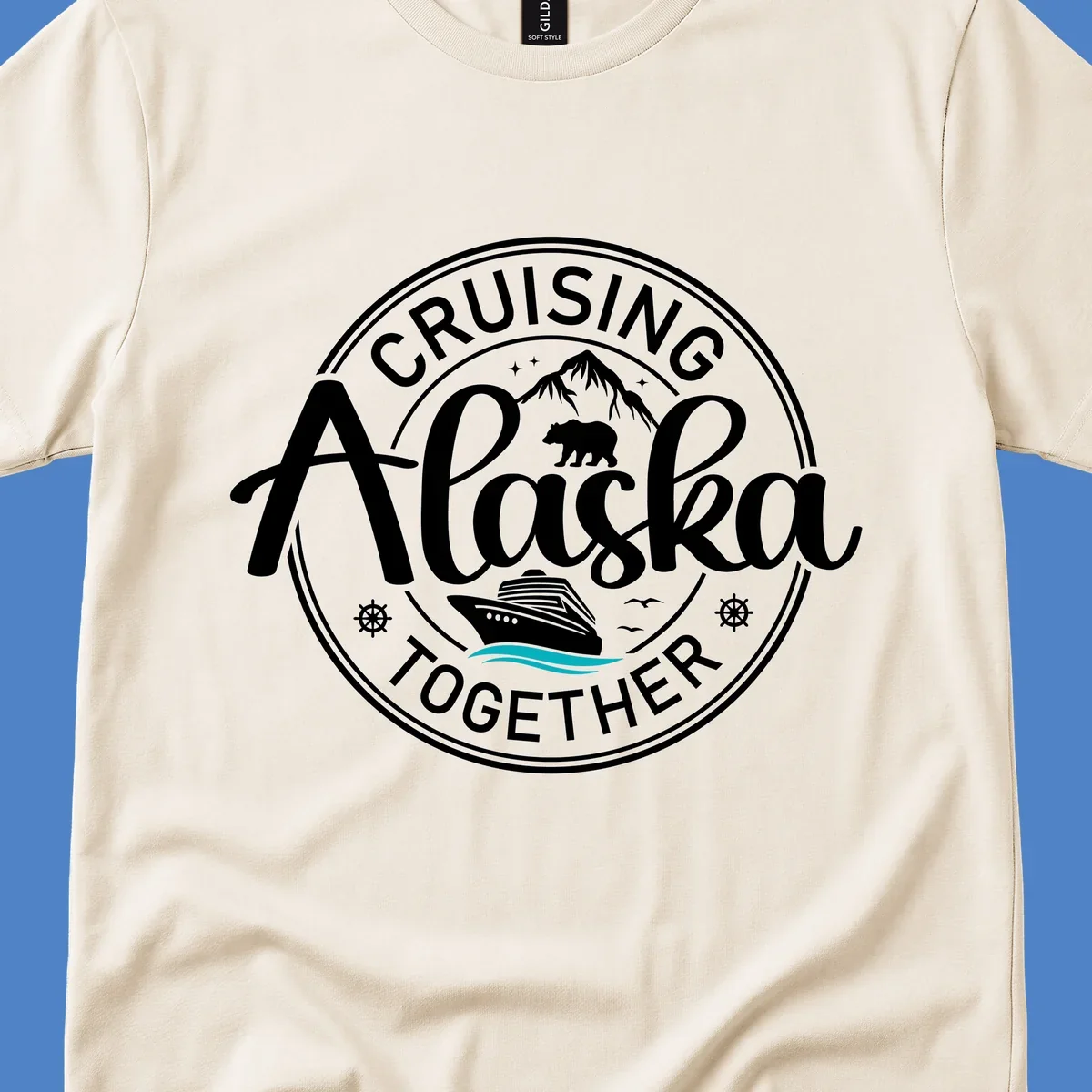 Circular badge design reading 'Cruising Alaska Together' with mountain, bear, and cruise ship illustrations in white and teal on gray background