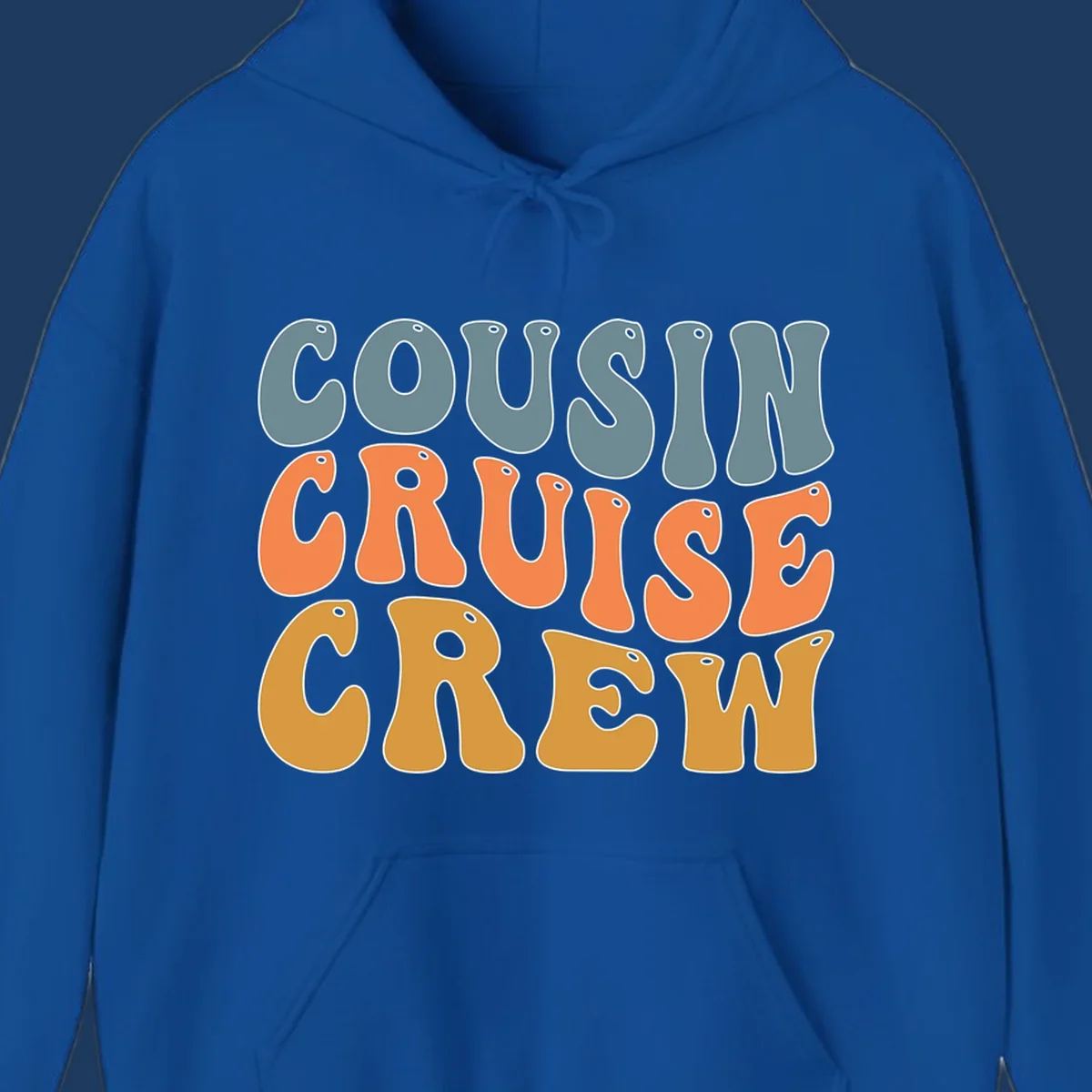 Colorful stacked text reading 'Cousin Cruise Crew' in teal, orange, and gold letters with nautical porthole details