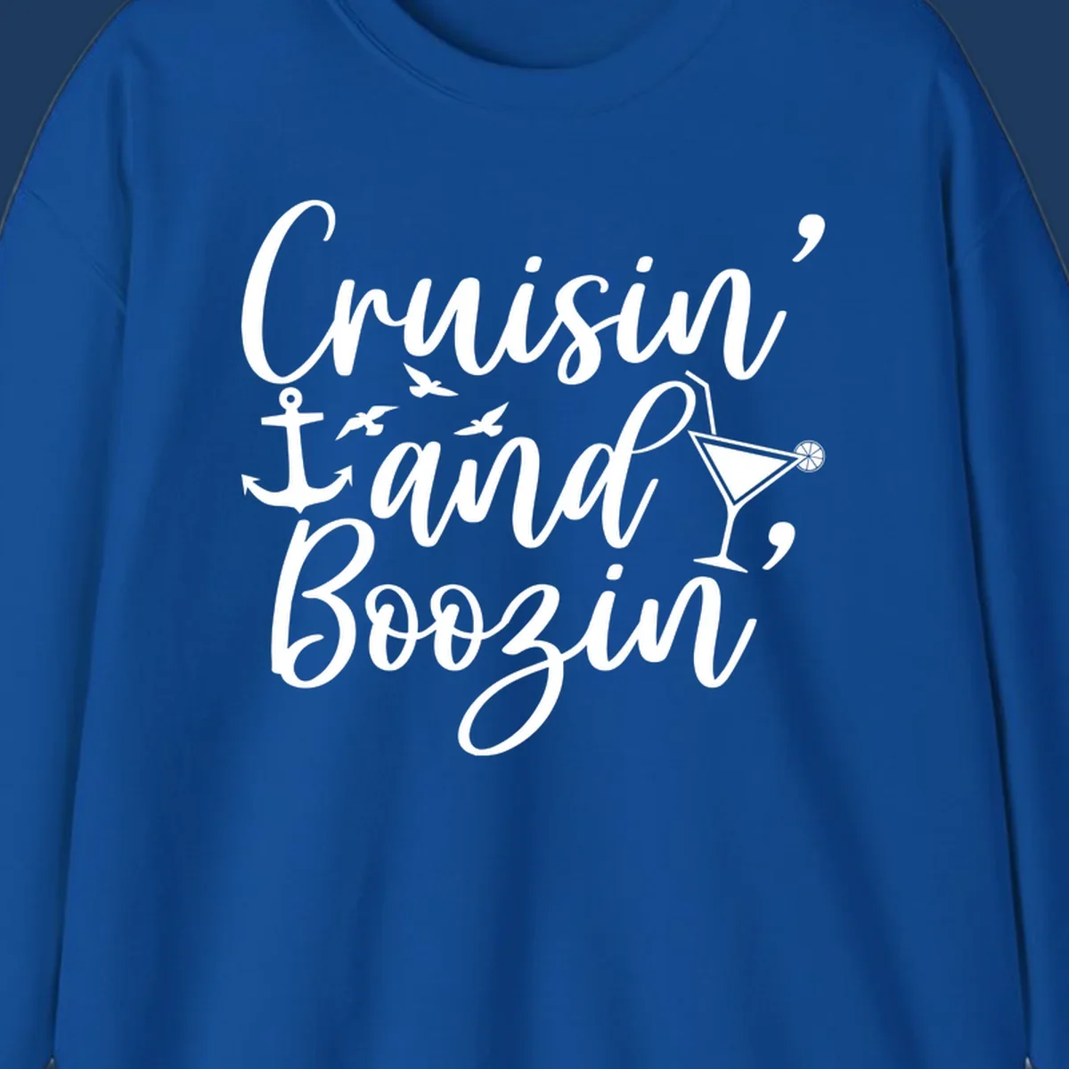 Cruisin and boozing nautical design with anchor, seagulls, and cocktail illustration on gray background