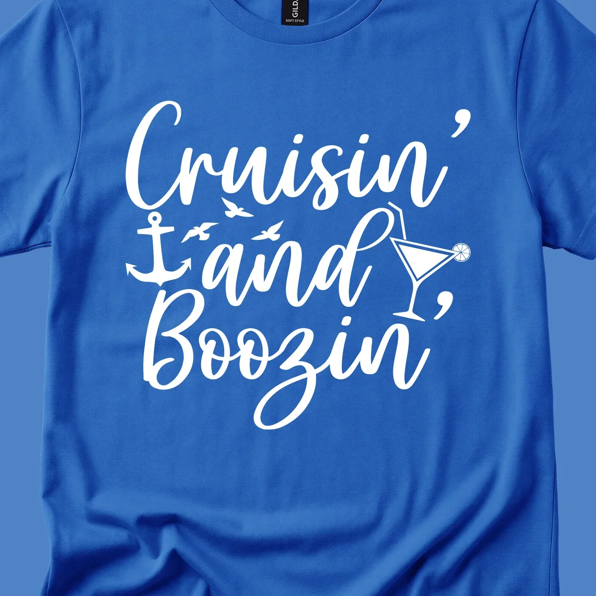 Cruisin and boozing nautical design with anchor, seagulls, and cocktail illustration on gray background