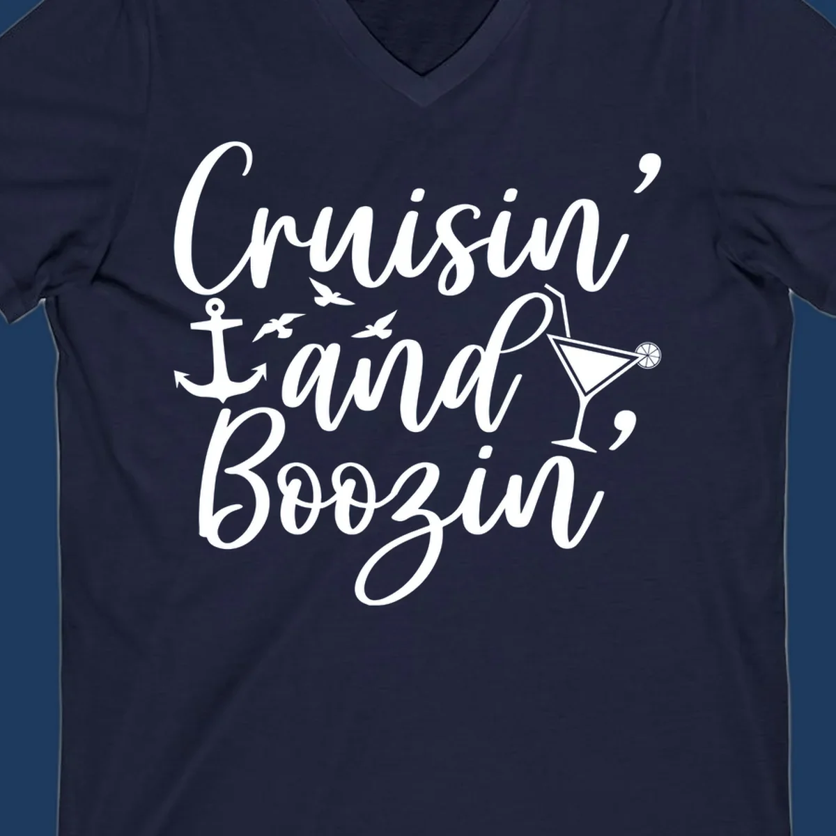 Cruisin and boozing nautical design with anchor, seagulls, and cocktail illustration on gray background