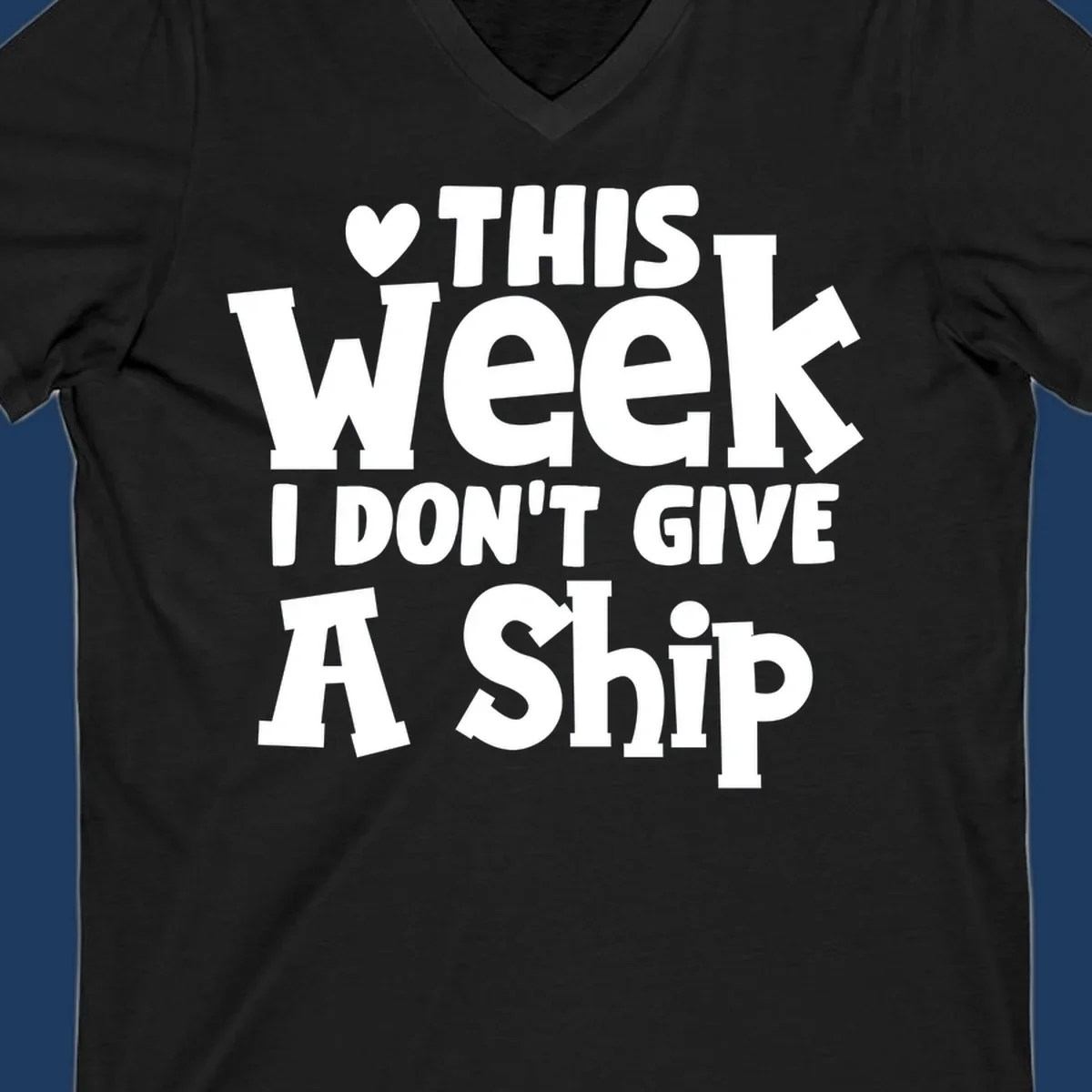 Bold white text reading 'Love This Week I Don't Give A Ship' with heart and arrow symbols on gray background