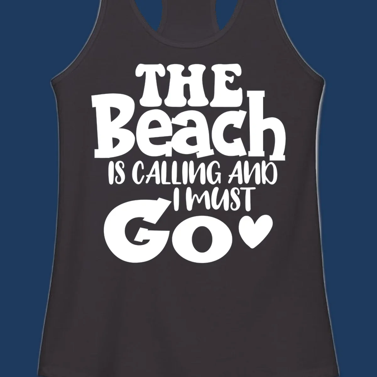 Beach is calling and I must go typography design with heart symbol, white text on gray background