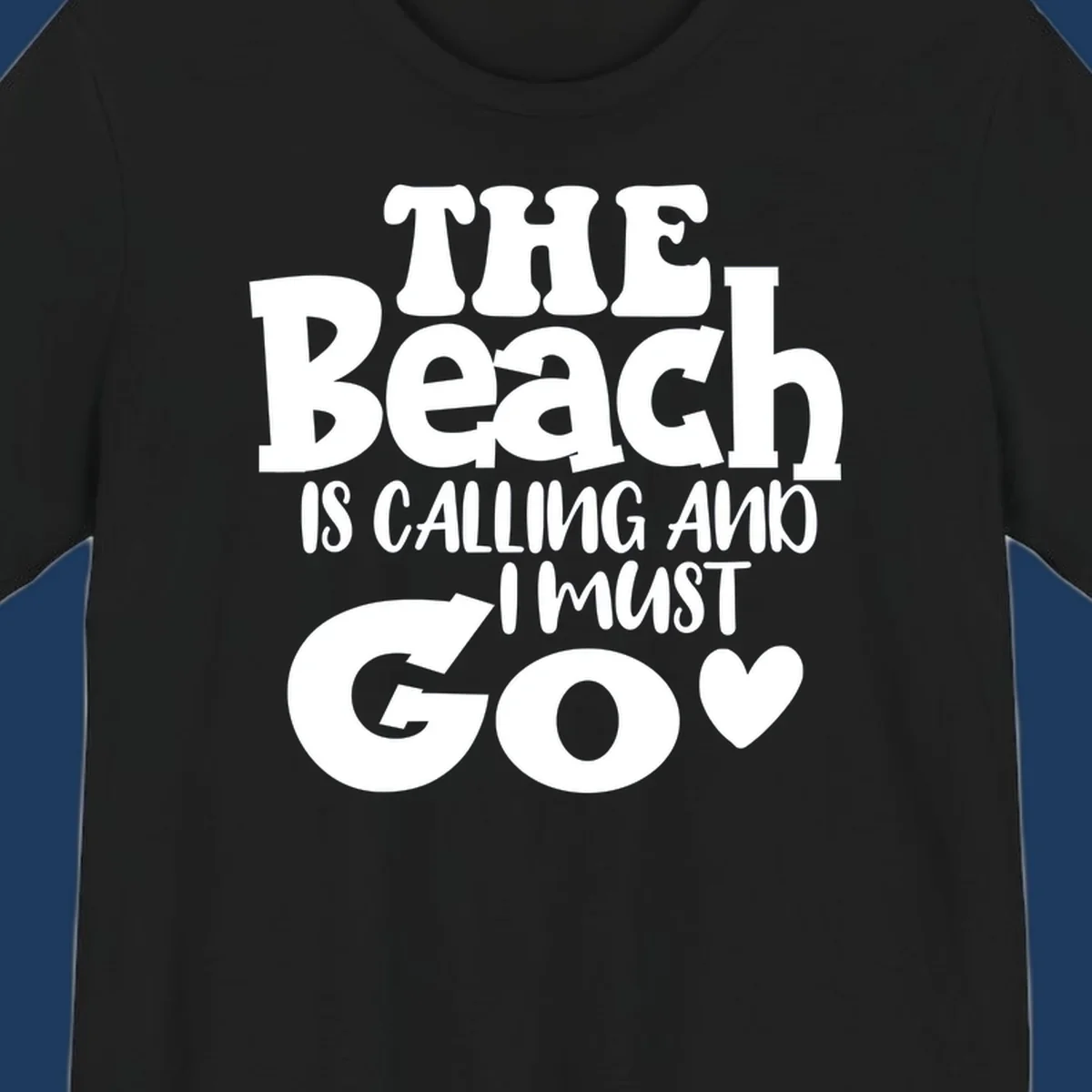 Beach is calling and I must go typography design with heart symbol, white text on gray background