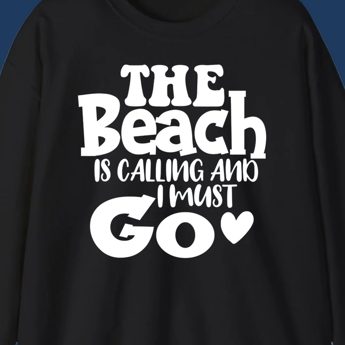Beach is calling and I must go typography design with heart symbol, white text on gray background