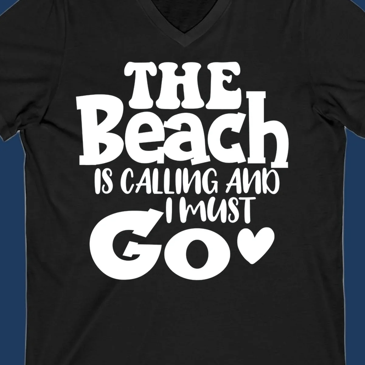 Beach is calling and I must go typography design with heart symbol, white text on gray background
