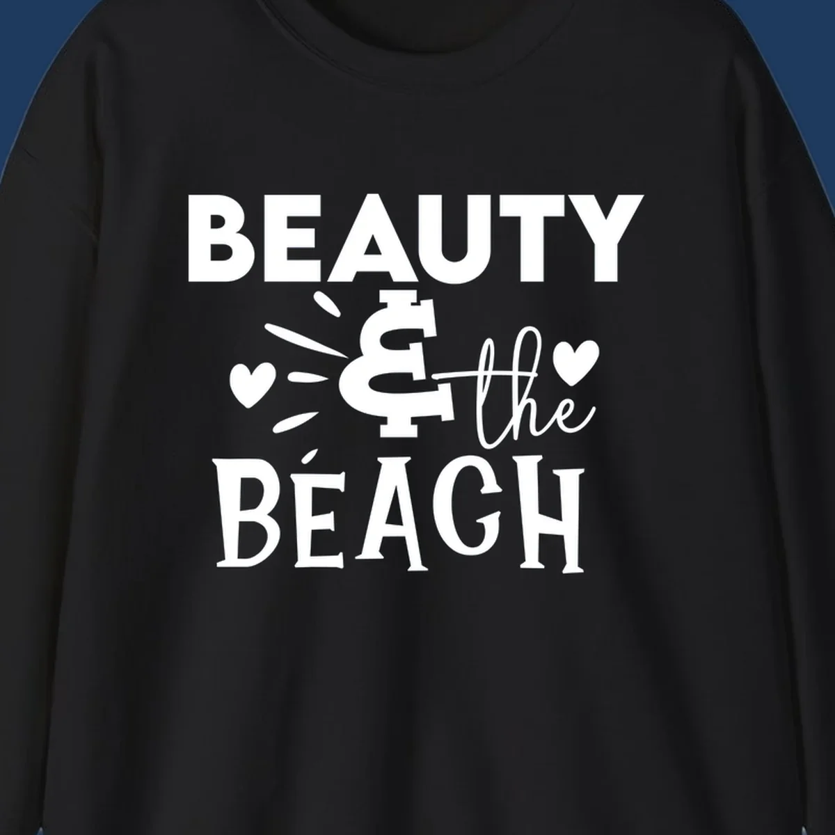 White text design reading 'Beauty & The Beach' with dollar sign symbol and heart decorations on gray background