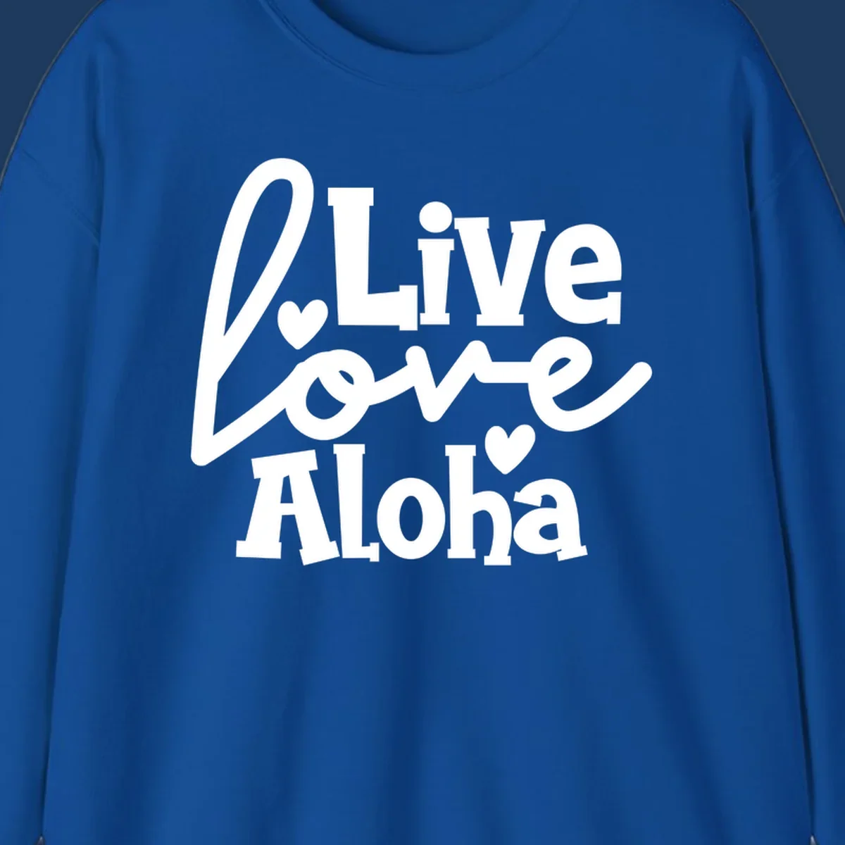 White decorative text reading "Live Love Aloha" with hearts on gray background, island-inspired cruise design