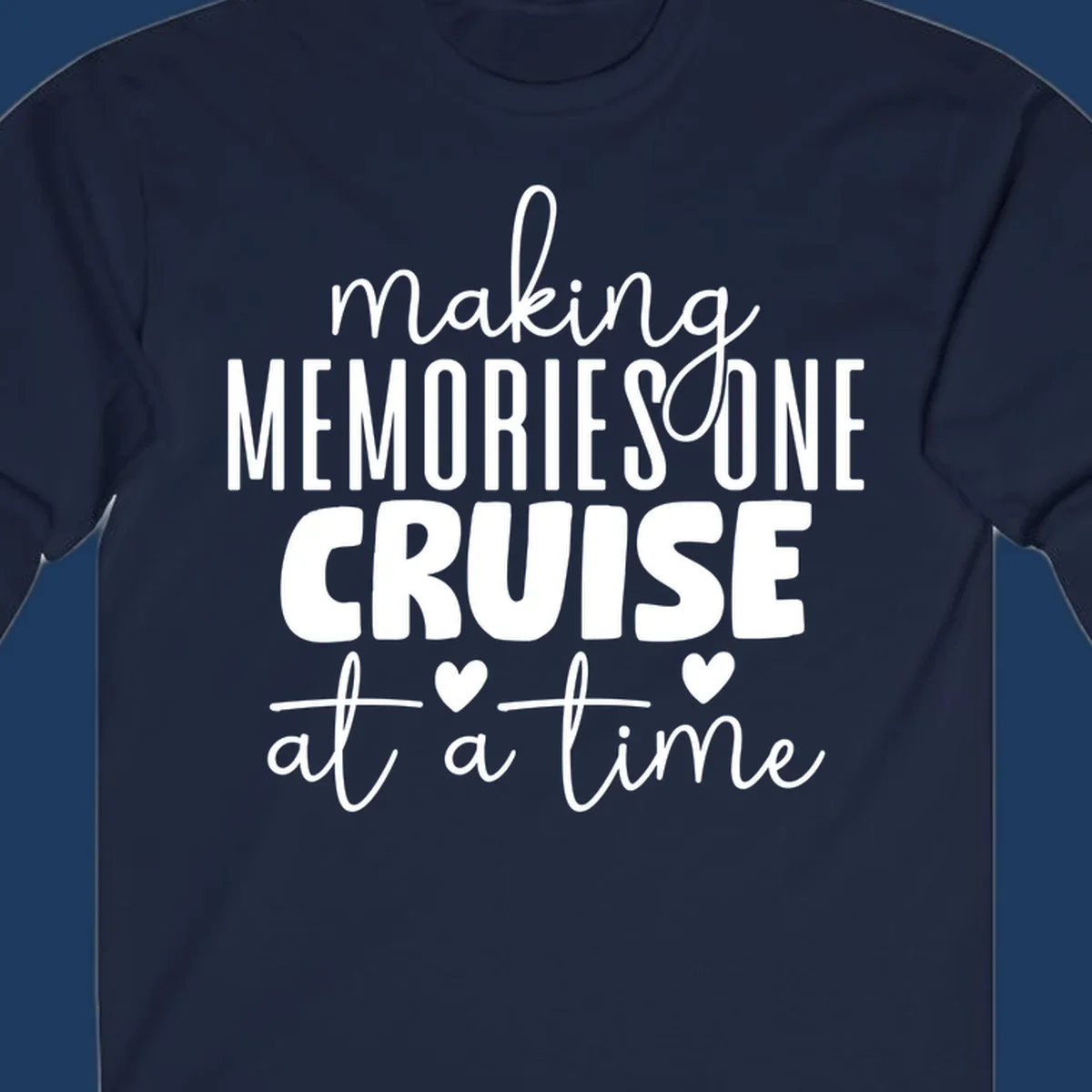 White text on gray background reading 'Making Memories One Cruise At A Time' with decorative hearts and flourishes for cruise vacation apparel