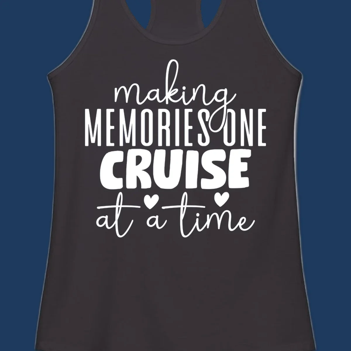 White text on gray background reading 'Making Memories One Cruise At A Time' with decorative hearts and flourishes for cruise vacation apparel