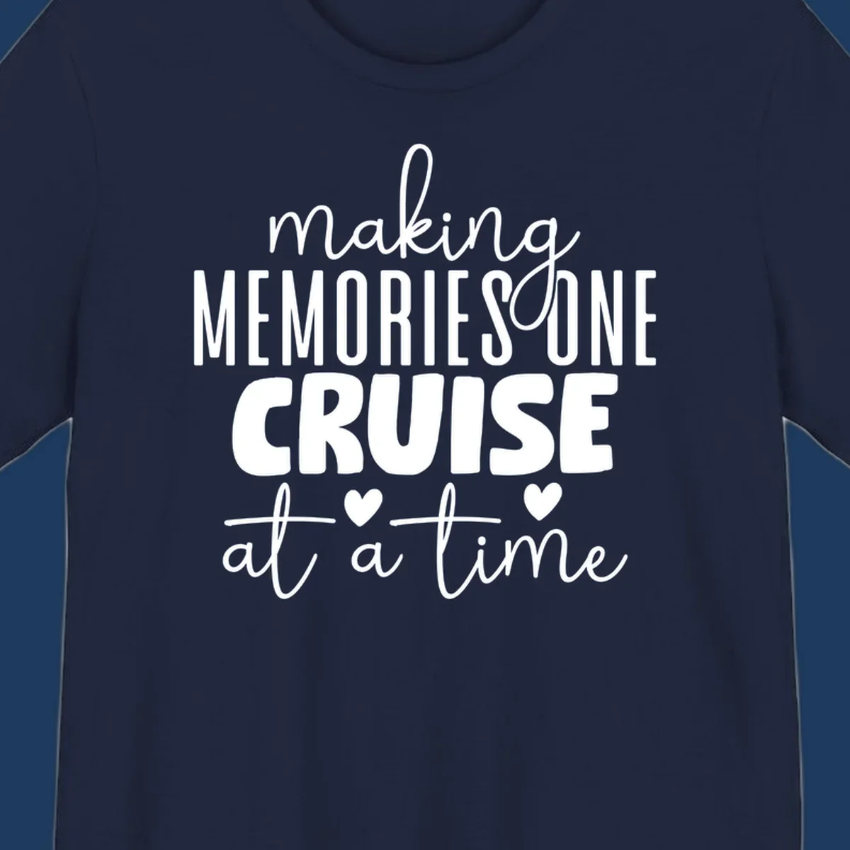 White text on gray background reading 'Making Memories One Cruise At A Time' with decorative hearts and flourishes for cruise vacation apparel