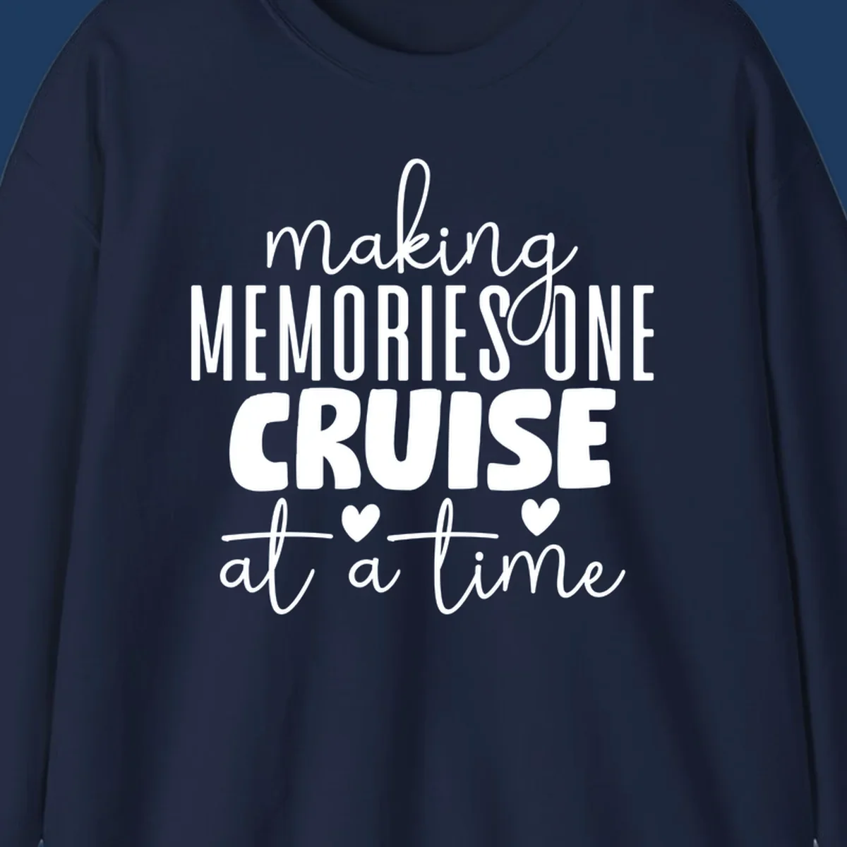White text on gray background reading 'Making Memories One Cruise At A Time' with decorative hearts and flourishes for cruise vacation apparel