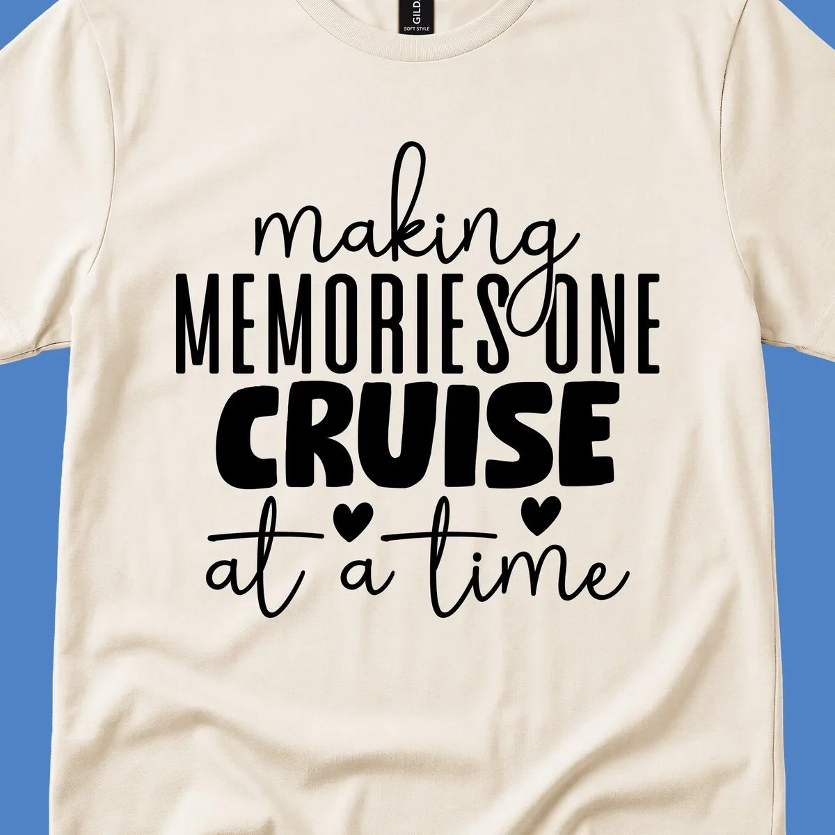 White text on gray background reading 'Making Memories One Cruise At A Time' with decorative hearts and flourishes for cruise vacation apparel
