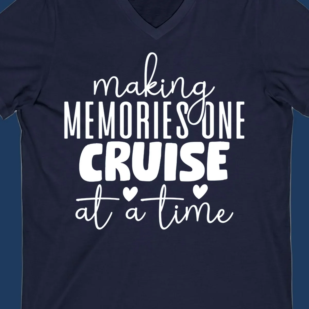 White text on gray background reading 'Making Memories One Cruise At A Time' with decorative hearts and flourishes for cruise vacation apparel
