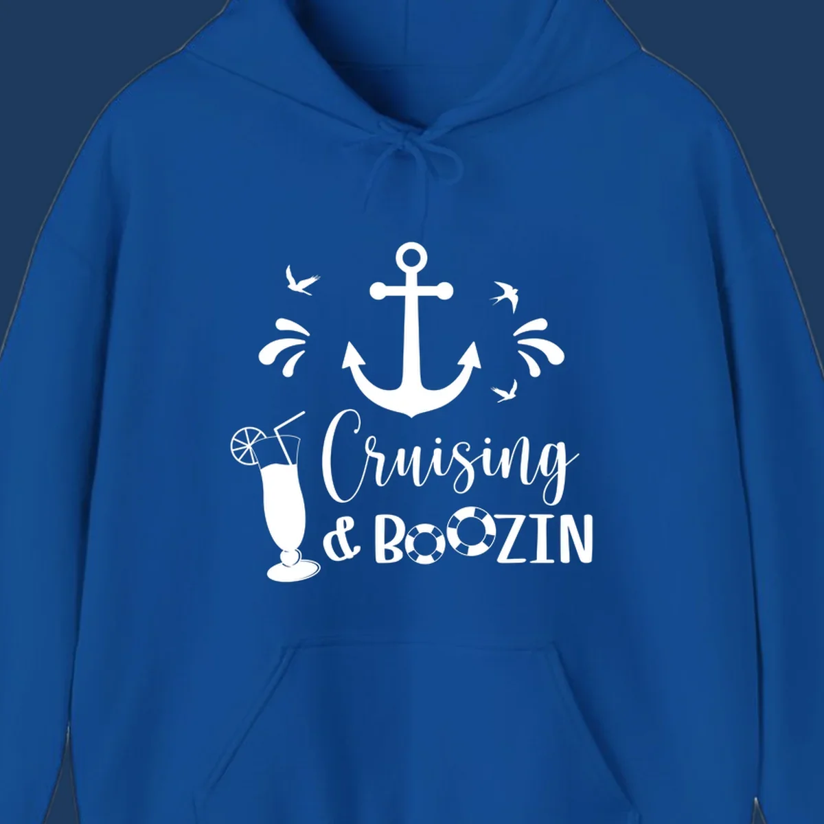 Cruising and boozin anchor design with nautical elements, cocktail, and seabirds on gray background
