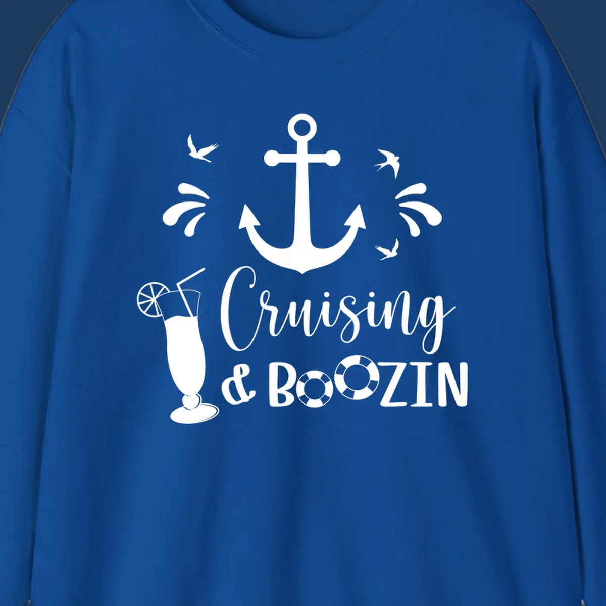 Cruising and boozin anchor design with nautical elements, cocktail, and seabirds on gray background