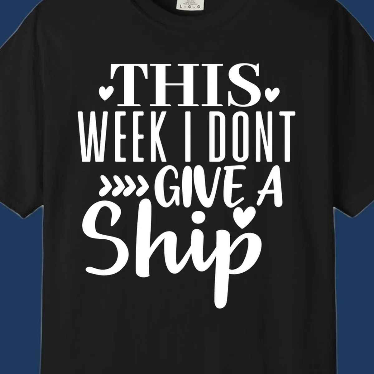 White text on gray background reading 'This Week I Don't Give A Ship' with hearts and arrows, a playful cruise humor design