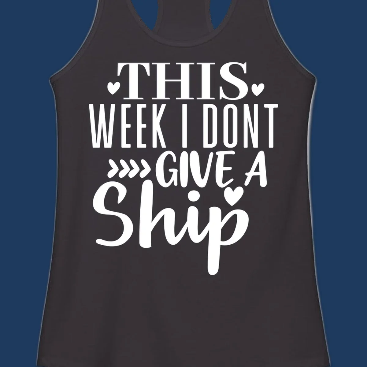 White text on gray background reading 'This Week I Don't Give A Ship' with hearts and arrows, a playful cruise humor design