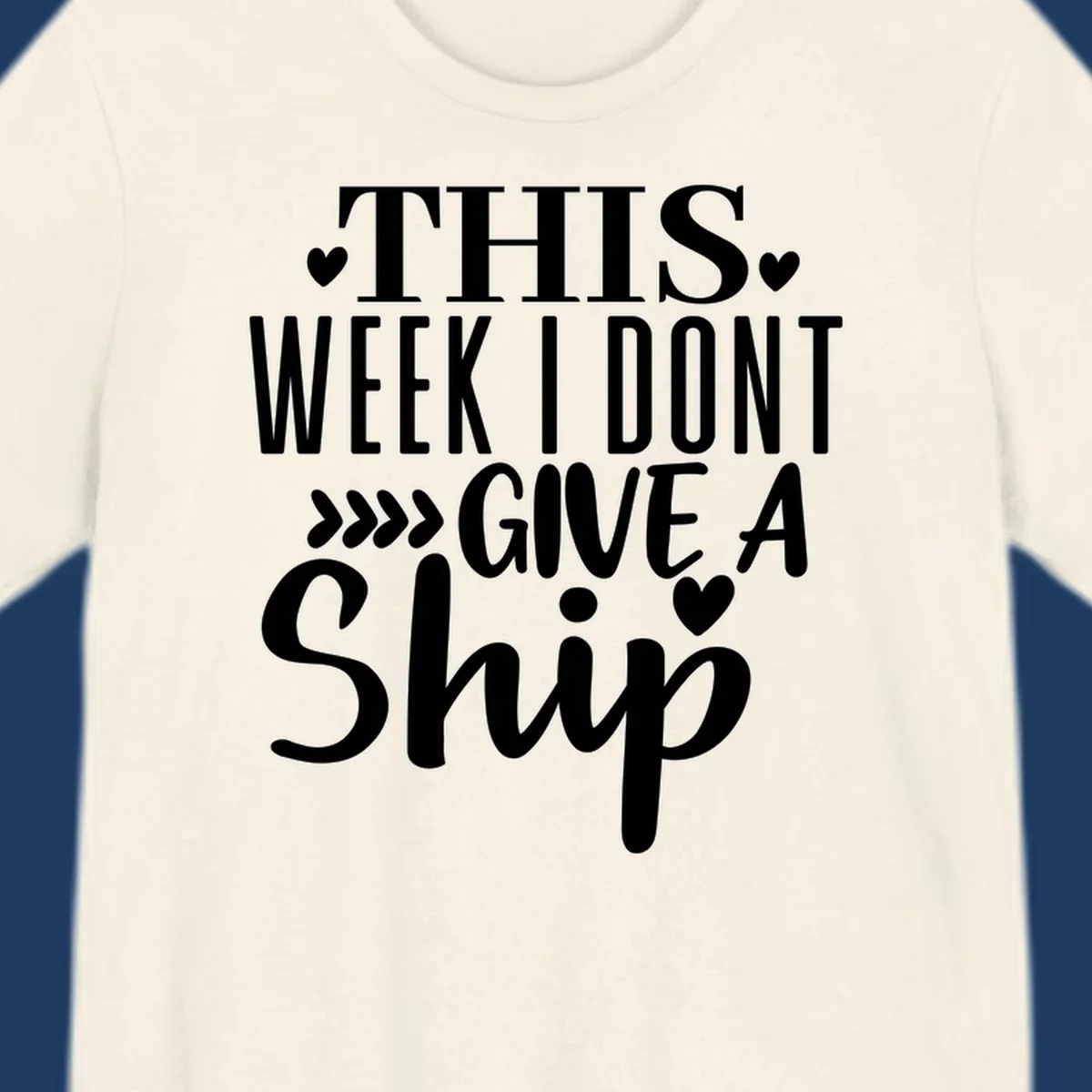White text on gray background reading 'This Week I Don't Give A Ship' with hearts and arrows, a playful cruise humor design