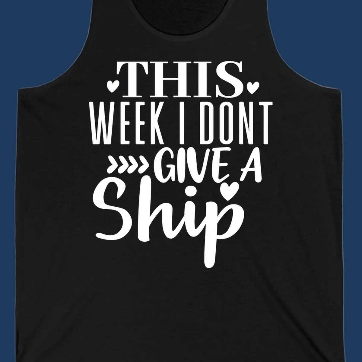 White text on gray background reading 'This Week I Don't Give A Ship' with hearts and arrows, a playful cruise humor design