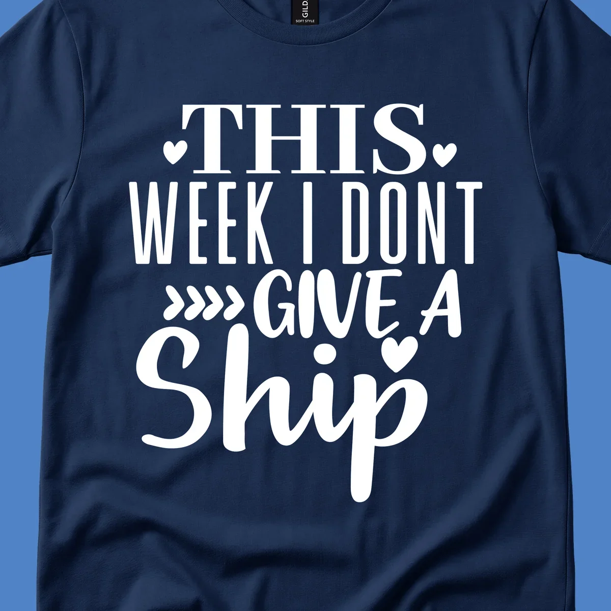 White text on gray background reading 'This Week I Don't Give A Ship' with hearts and arrows, a playful cruise humor design