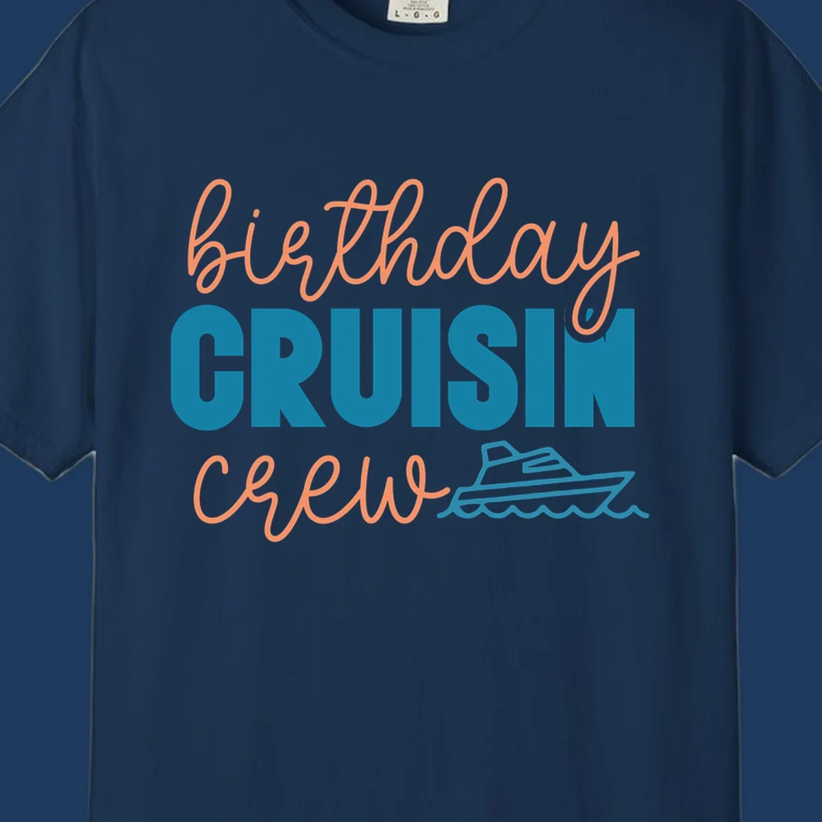 Birthday crushin crew design with coral script text, teal ship illustration, and ocean waves on gray background